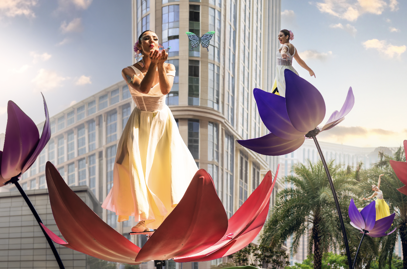 A high-impact performance by BPM Productions Hong Kong featuring "floral muse" dancers on sway poles interacting with the audience at City of Dreams Macau.