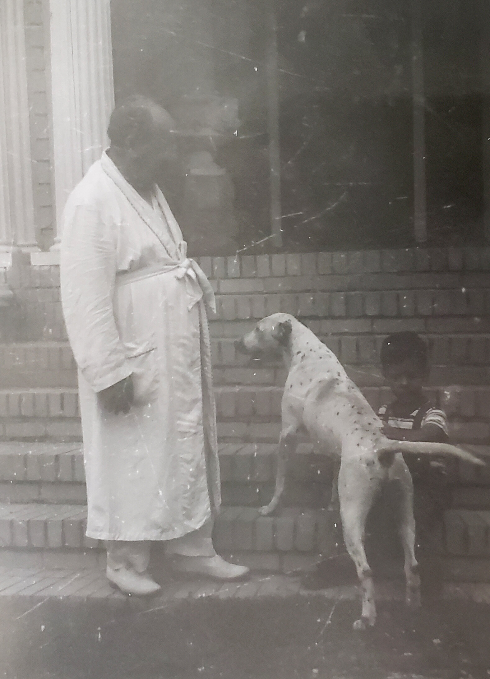 Amedeo in his robe with his dog