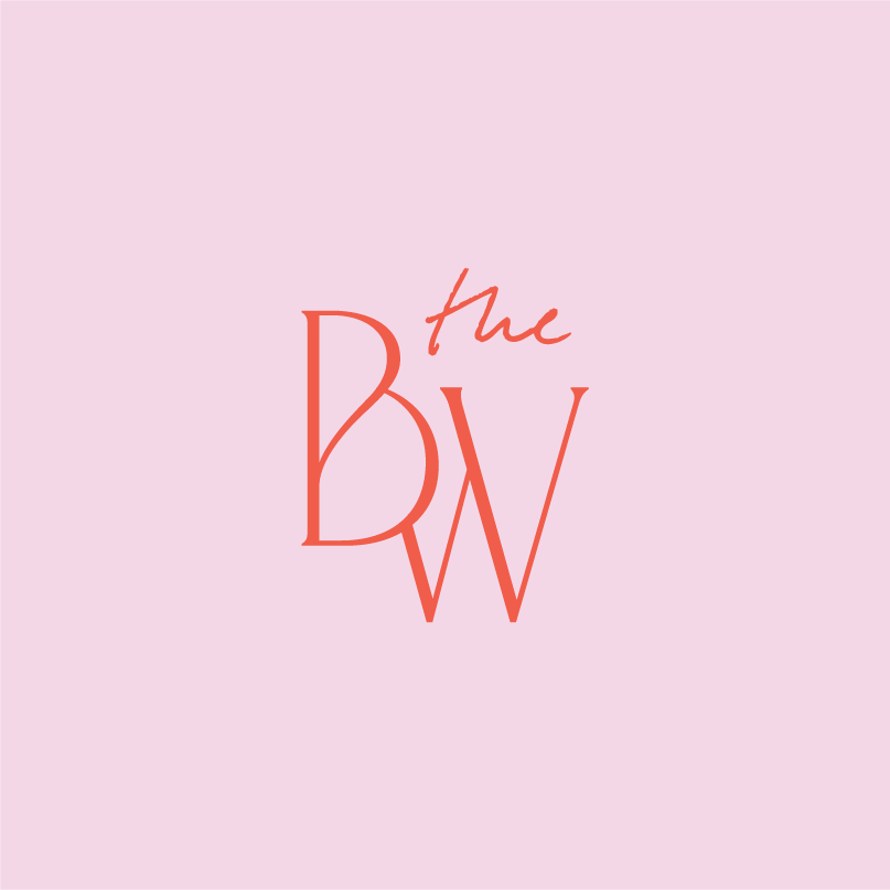Primary logo design for The Breadwinners featuring a BW monogram and script typography in coral on blush background.
