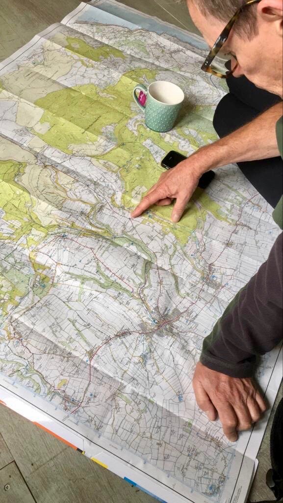Byway traveller Rob reading map planning a walk in the North York Moors.