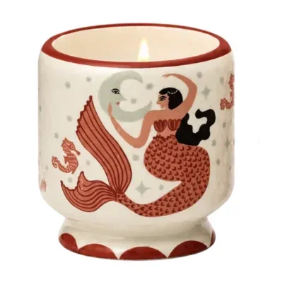 Bougie Mermaid & Moon Paddywax, mèche allumée et ambiance chaleureuse.