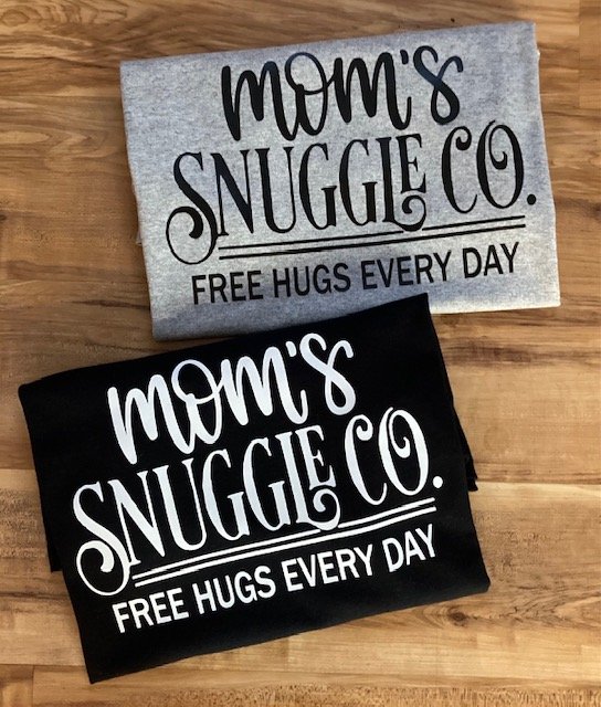 Shop this unique custom designed “Mom’s Snuggle Co. Free Hugs Every Day” Mom t-shirt. This t-shirt makes a great for anyone’s Mom’’s birthday, Christmas Gift, Mother’s Day or just because!