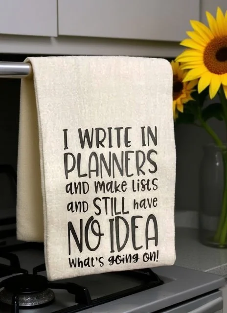 Write in planners on stove with sunflower .jpg