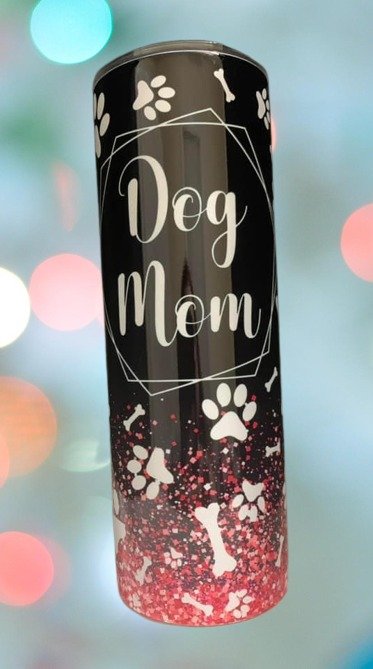 20-ounce stainless steel tumbler with 'Dog Mom' design. Perfect for keeping beverages hot or cold. Durable and stylish for dog lovers