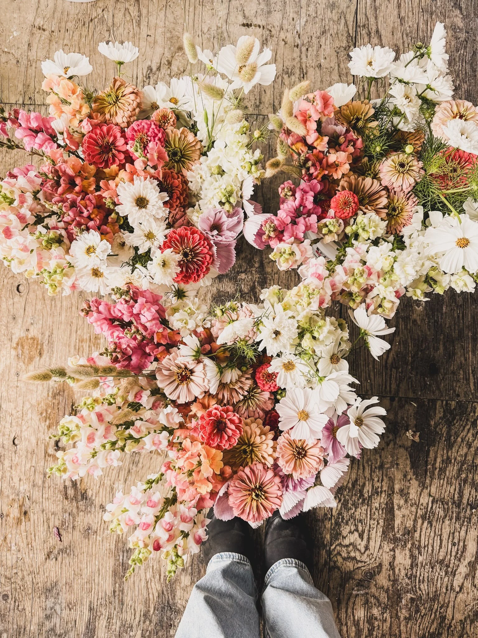 Long awaited rainfall has come to us with much cooler temperatures. Thirsty for days, the crumbling earth has drunk in every drop and continues to absorb the constant water falling from the sky. 

Just before the heavy downpour I cut as many flowers 