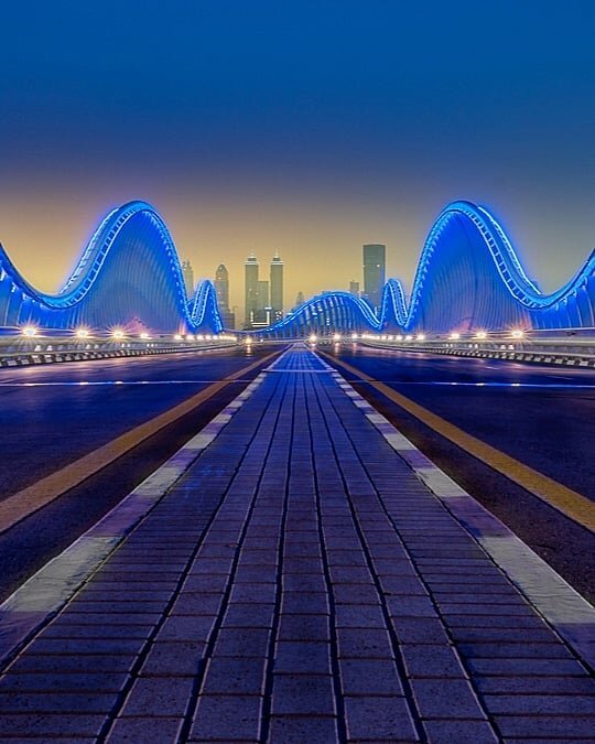 Nice Dubai sunset at Meydan bridge. Multiple exposures blended with photoshop, one shot for the sky, one for the bridge and another for the lights. 
EXIF data:

Focal length:  18 mm
Shutter speed:  30s
Aperture:  f11
Iso:  100

Edited with: LR &amp; 