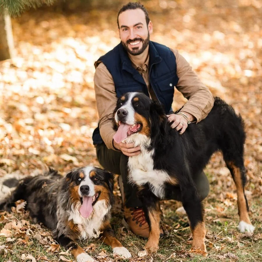 James Stokes, founder of Stokeshire Designer Doodles, with an Australian Mountain Doodle puppy in Medford, Wisconsin