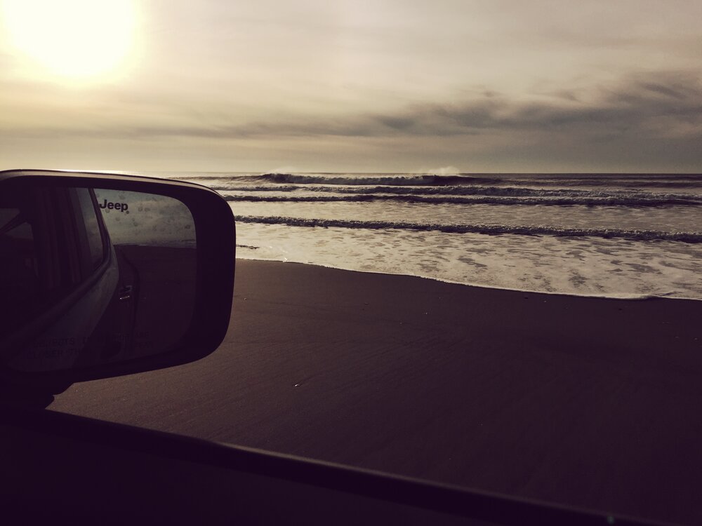 Driving on the beach in Ocean Shores in our Jeep Renegade Trailhawk at sunset