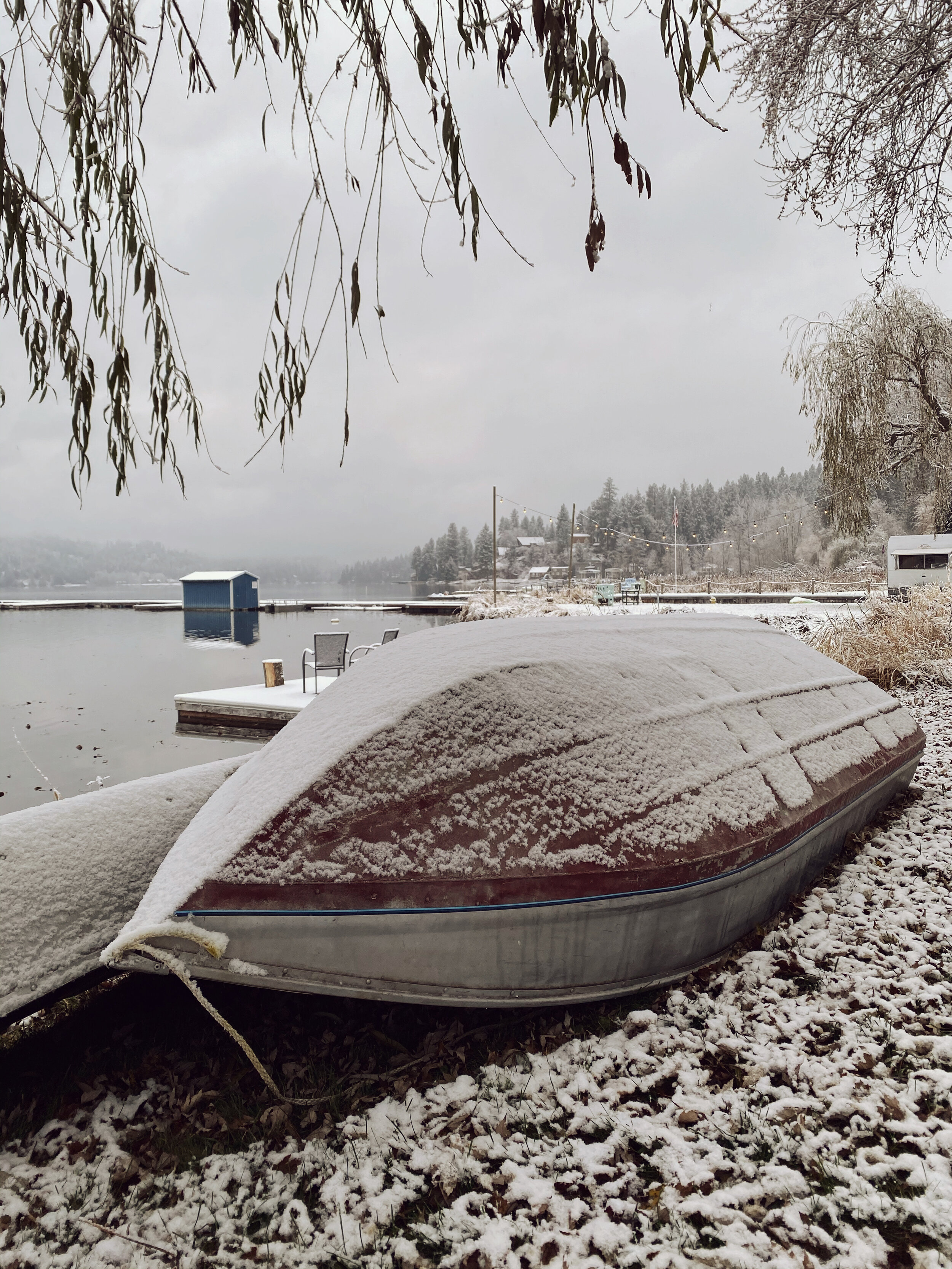 Fresh snow on Canoe and boat Newman Lake (Copy)