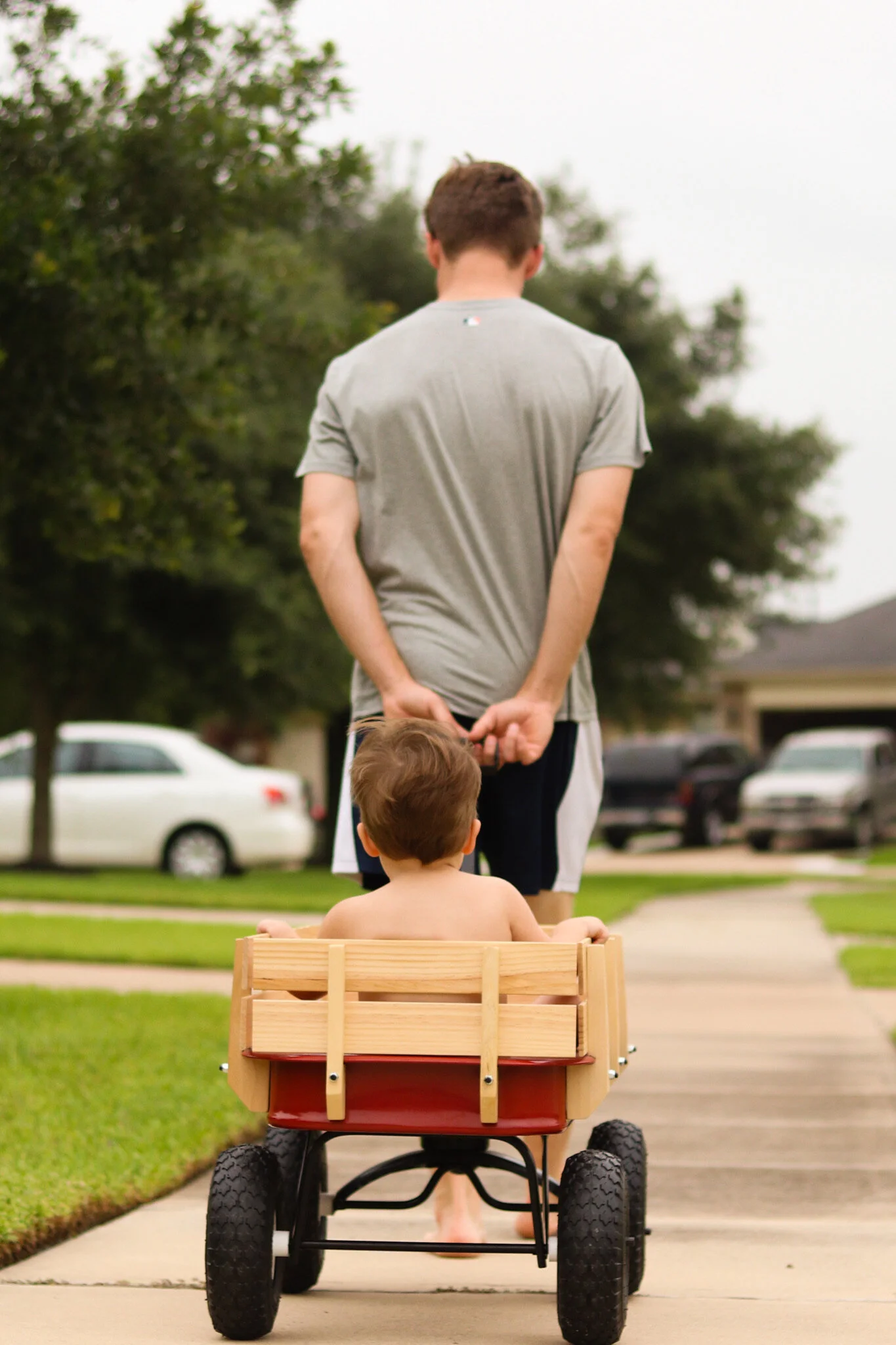 An evening walk in the little red wagon. Richmond, Texas
