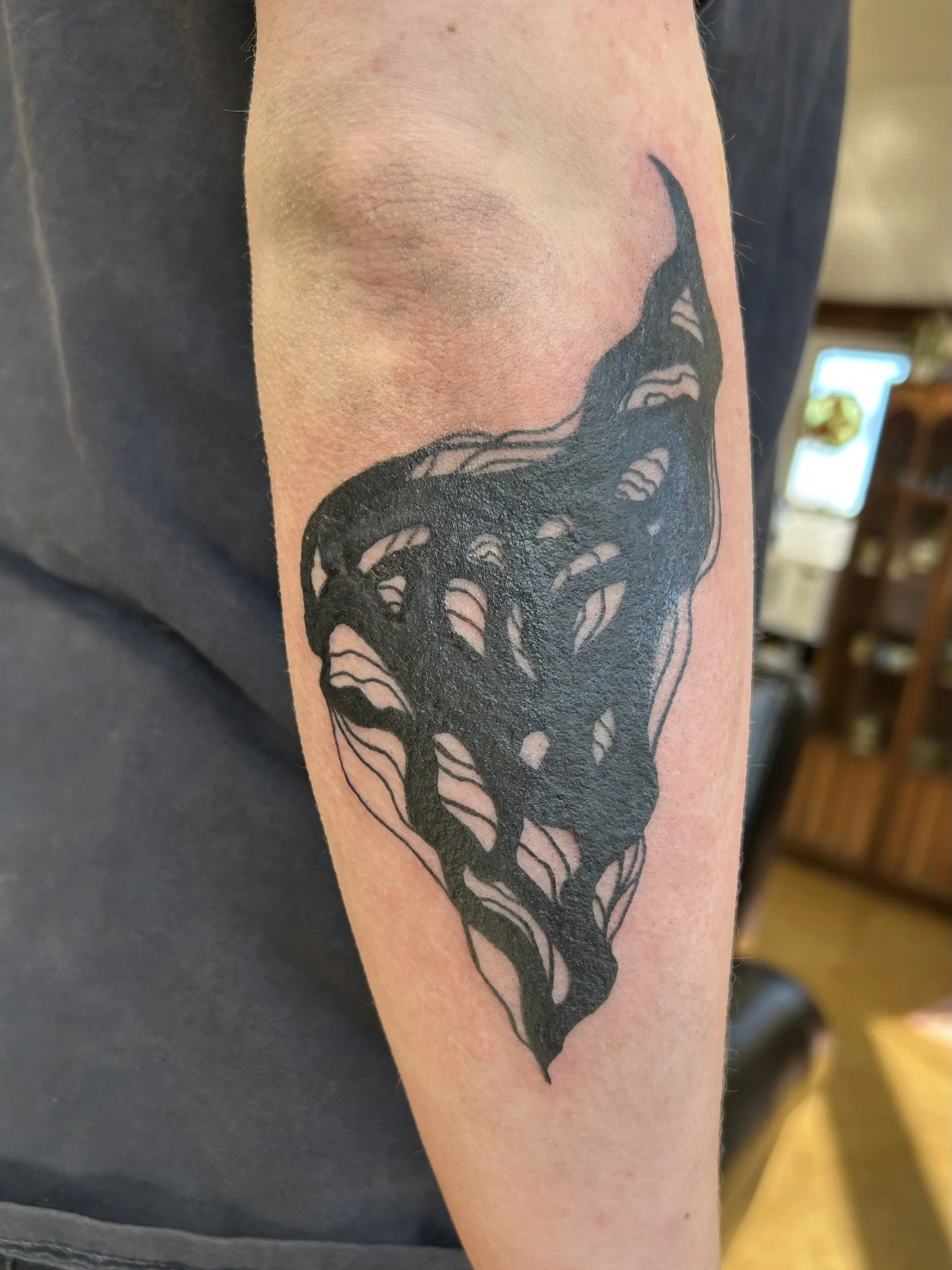 abstract, drawn-on blackwork cover up