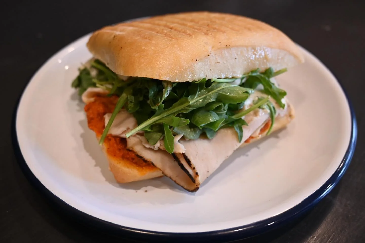 Come try our smoked chicken panini with fresh mozzarella, house made romesco and arugula!  The perfect lunch on a chilly July day! #langleykitchenforlunch