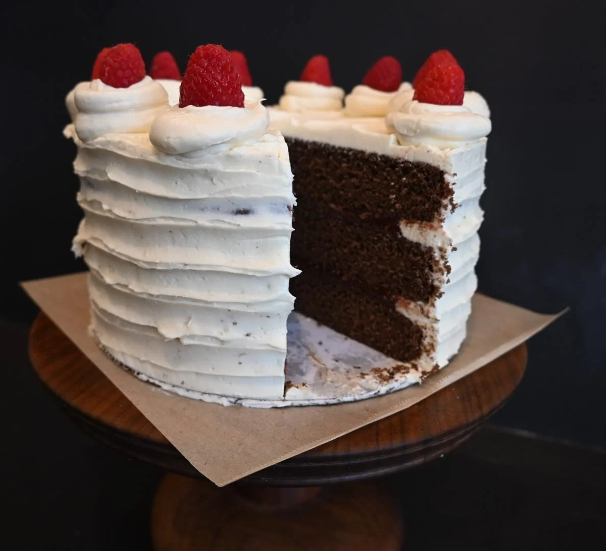 Treat yourself to a slice of chocolate cake with raspberry filling, white chocolate frosting and fresh raspberries!  #langleykitchen #treatyourselftocake