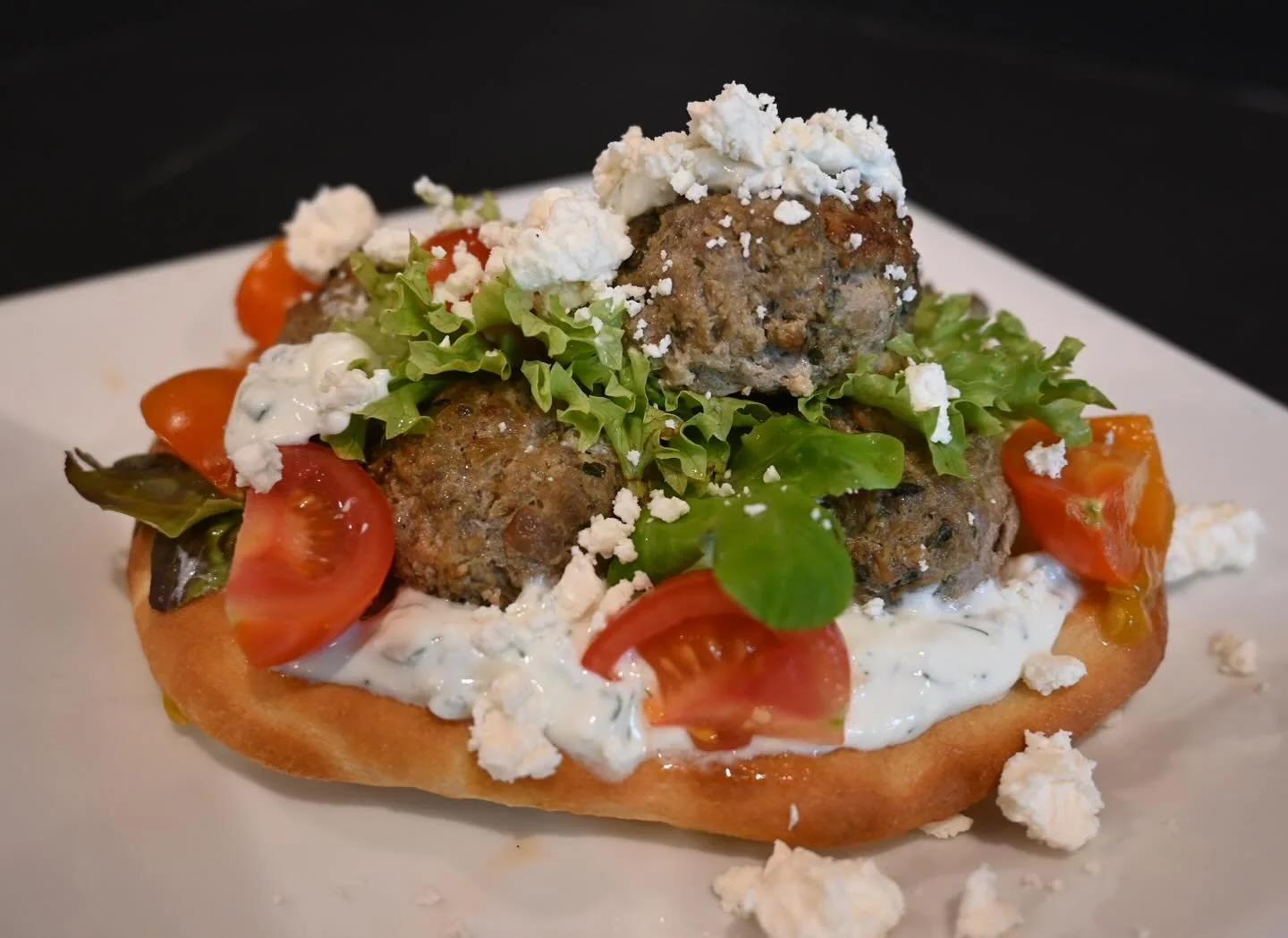 Come try our lamb meatballs in fresh, house made pita for lunch today!  Served with local @foggyhillfarm lettuce, cherry tomatoes, feta and tzatziki sauce.  Healthy and delicious! #langleykitchen