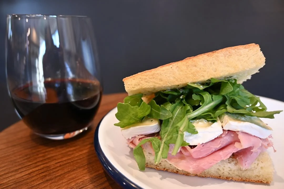 Treat yourself to Friday lunch!  We have a grilled ham and brie cheese sandwich with fig jam and arugula today.  Pair it with our house red for a special treat!  We love this Syrah Grenache blend by winemaker Marius Chapoutier. The labels on these wi
