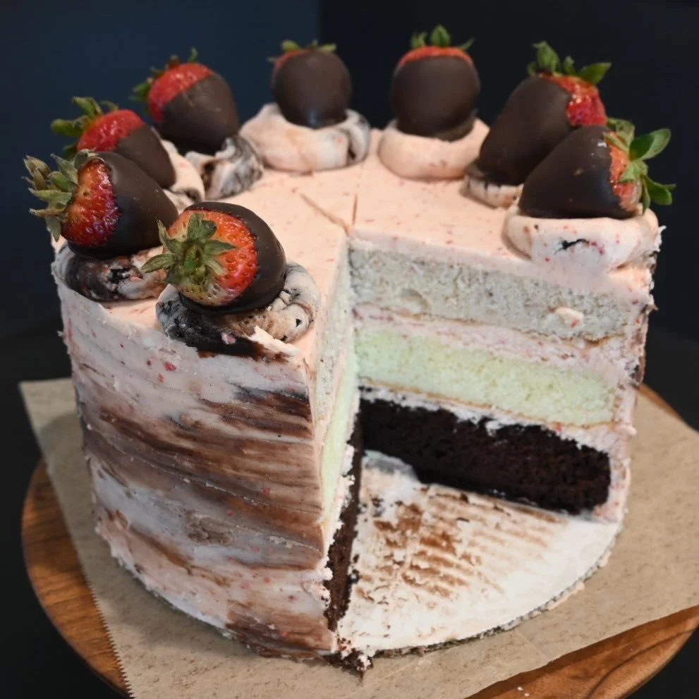 Come on in for a piece if Strawberry Neapolitan Cake today!  Topped with chocolate dipped strawberries, this is pure childhood nostalgia on a plate!
#langleykitchencakes