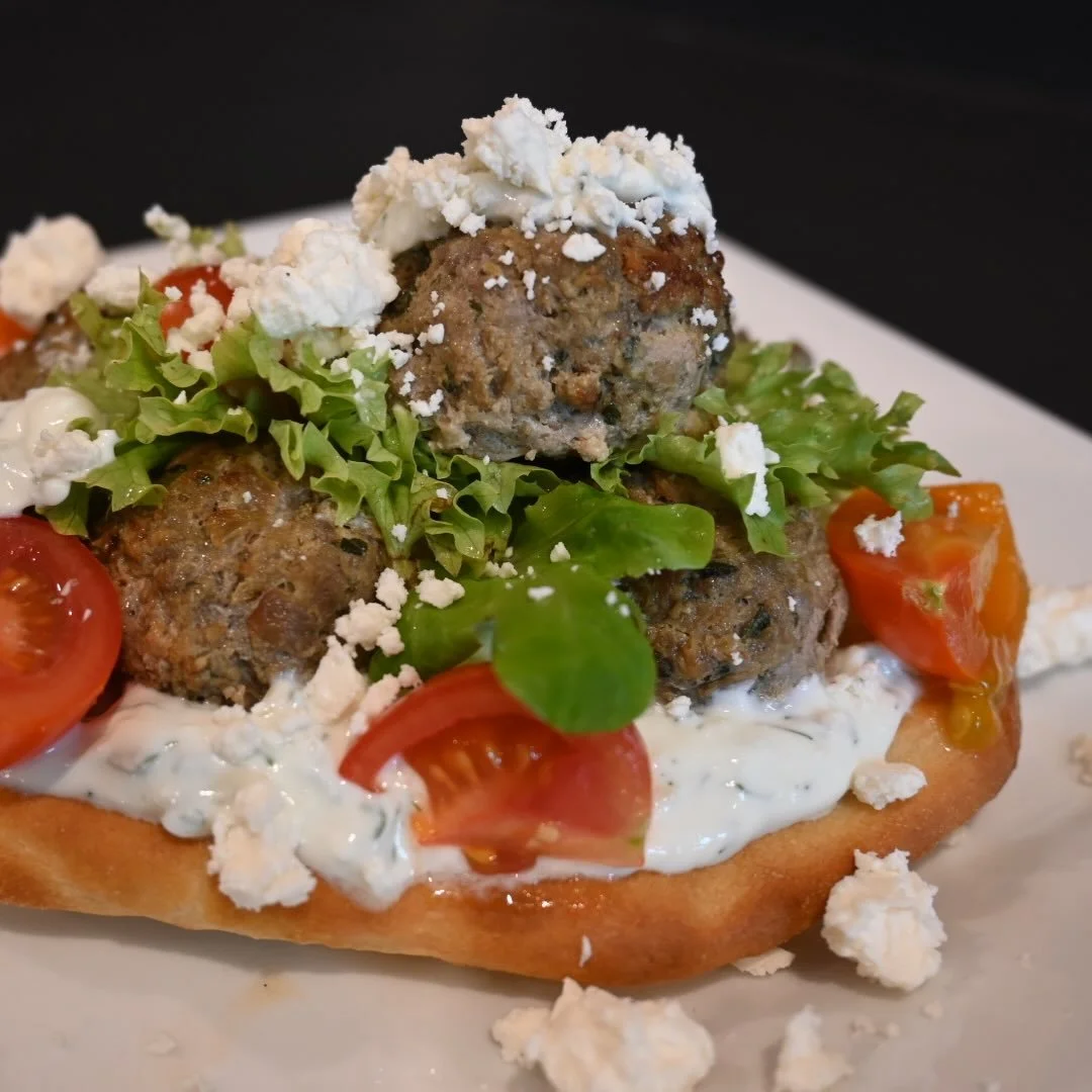 Come try our house made pita with spiced organic beef meatballs, @foggyhillfarm mixed greens, cucumbers, feta and lettuce with a lemon tahini sauce.  Perfect for lunch!