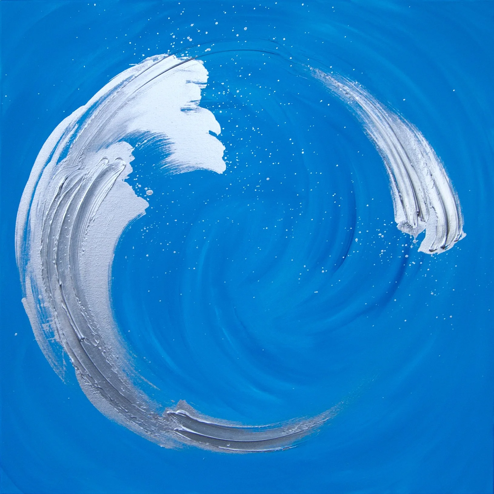 A blue canvas with white acrylic paint forming a large wave or swirl pattern.