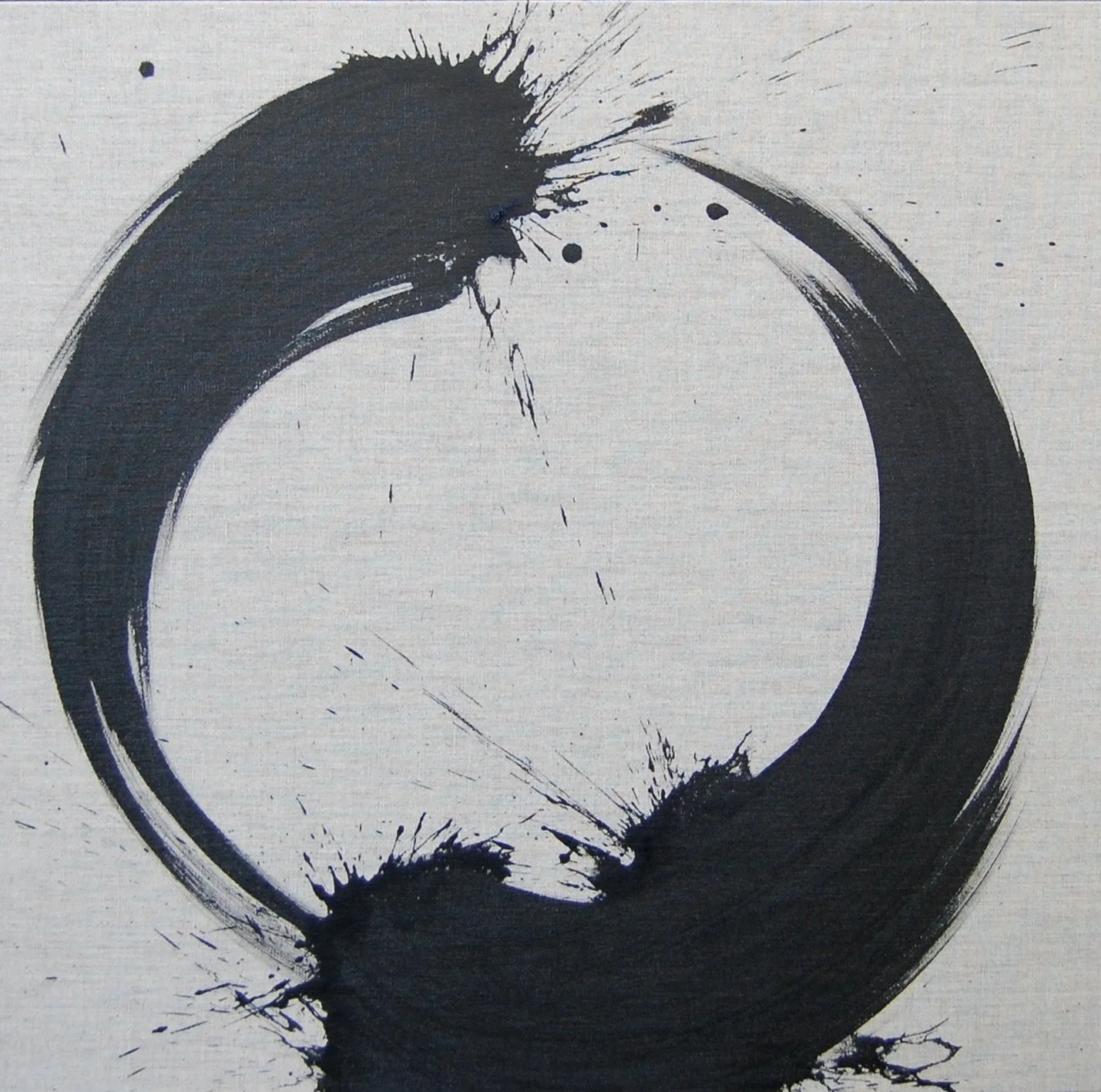 An ink painting of an Enso circle with black ink splatters on a white background.