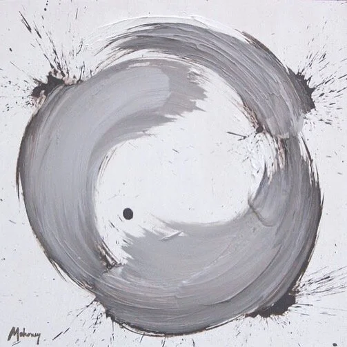 Abstract black and white circular paint stroke on white background.