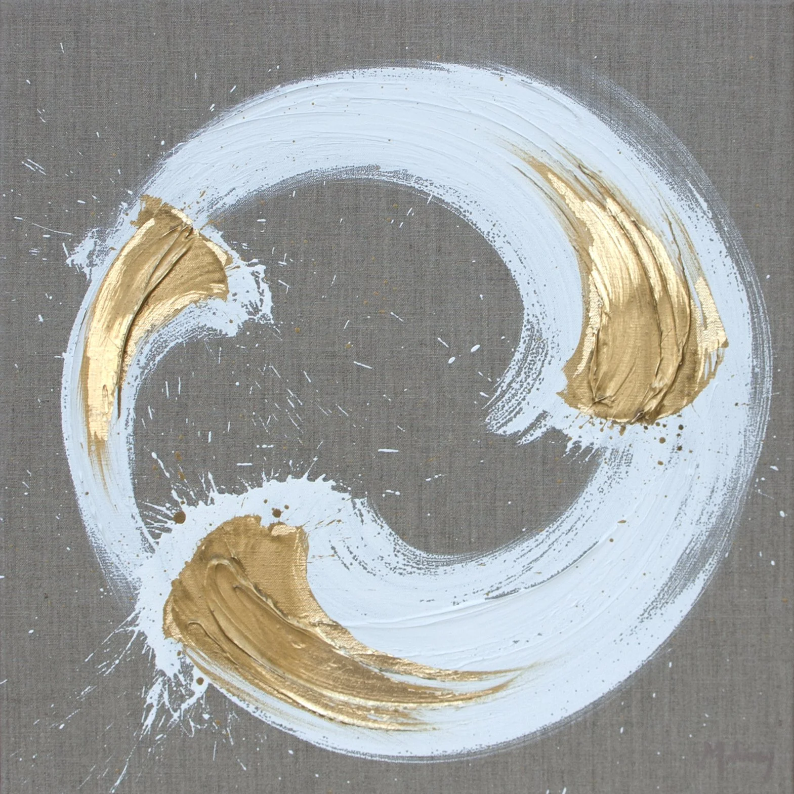 Abstract art with white and gold paint swirled in a circle on a gray background.