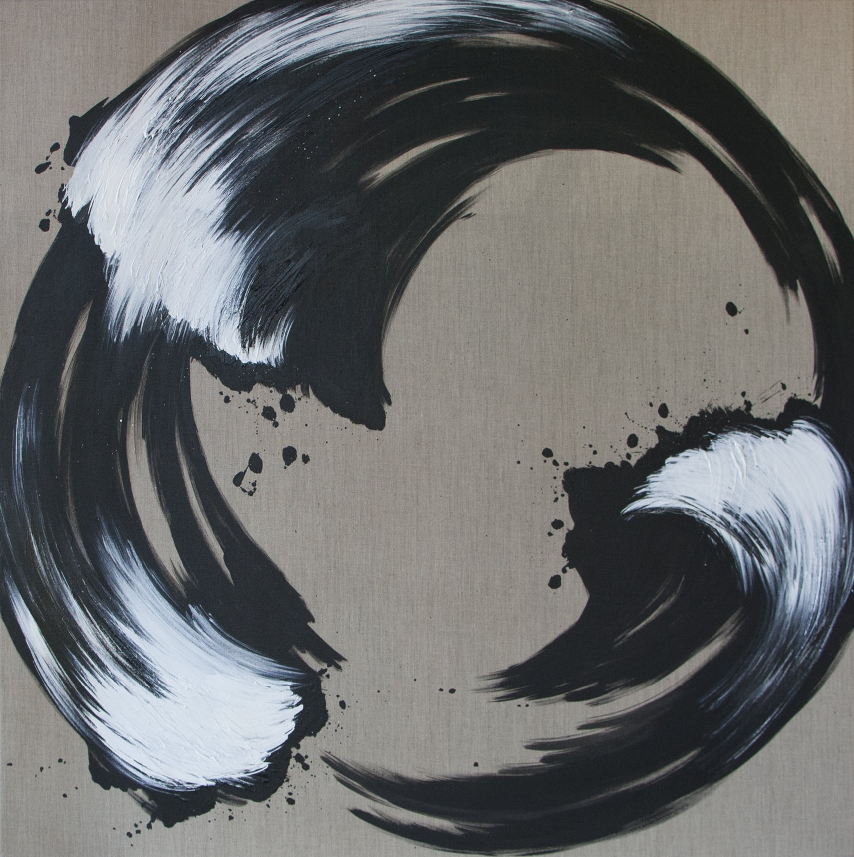 Black and white abstract circular brushstroke on beige background with paint splatters.