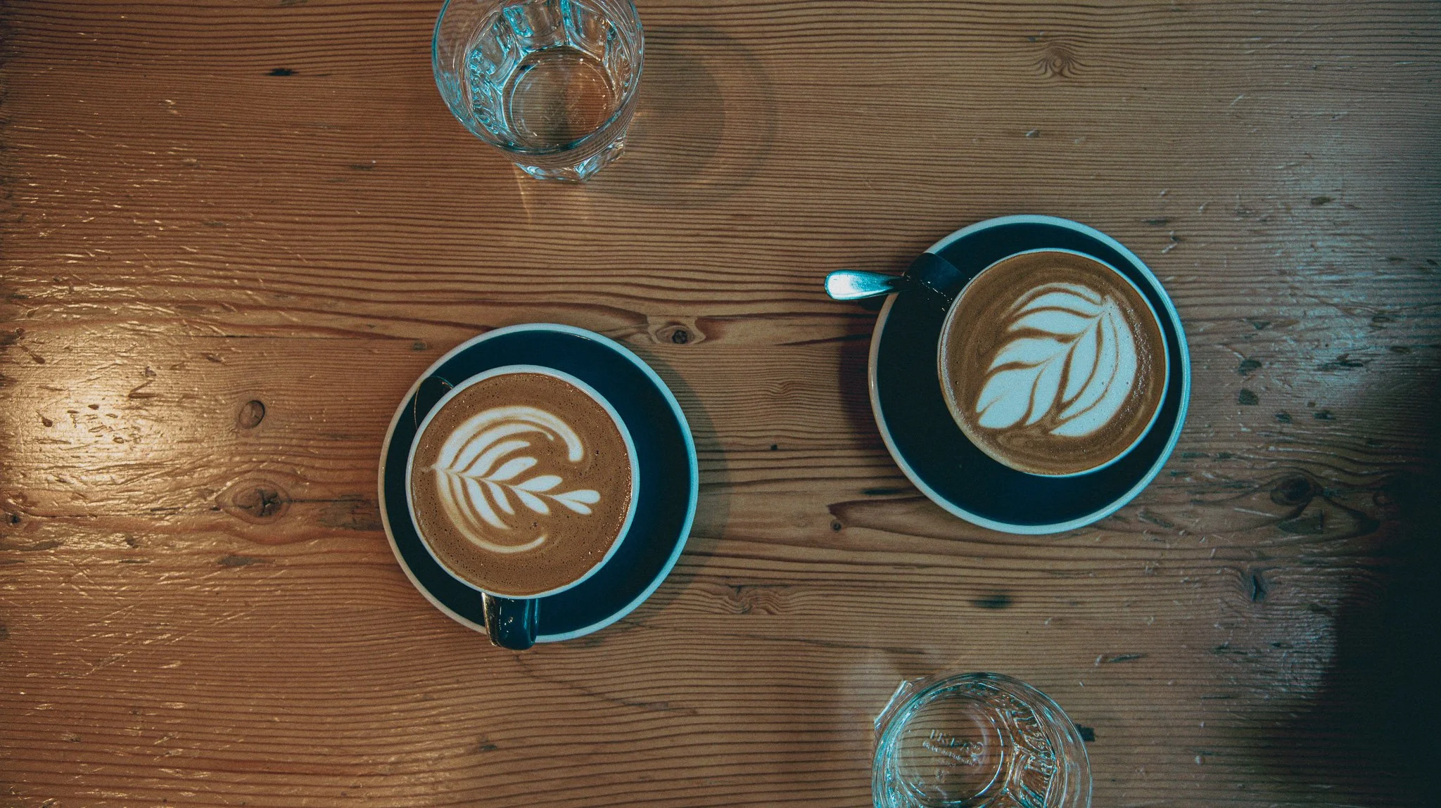Two beautifully prepared cappuccinos at a downtown Vancouver, bc cafe.