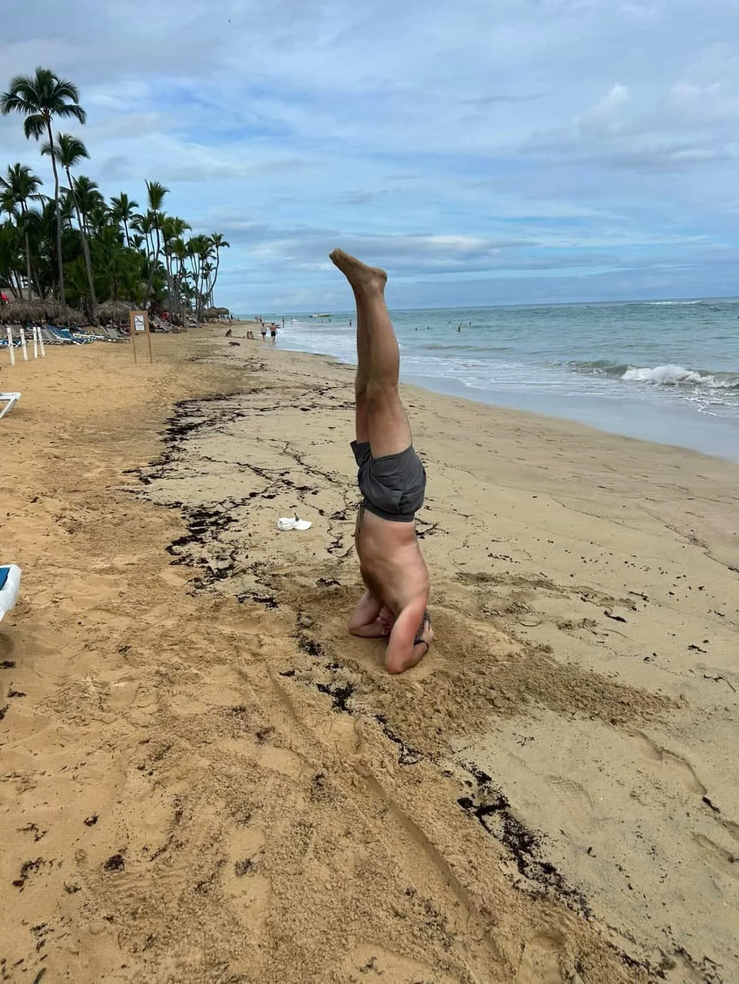 Vacation level: upside down 🧘🏝️. Huge congrats to our student for hitting one of his goals on his birthday vacation! From studio practice to palm tree paradise&mdash; strength, balance, and a little bravery paid off. So proud! #thenestyogasaintjohn