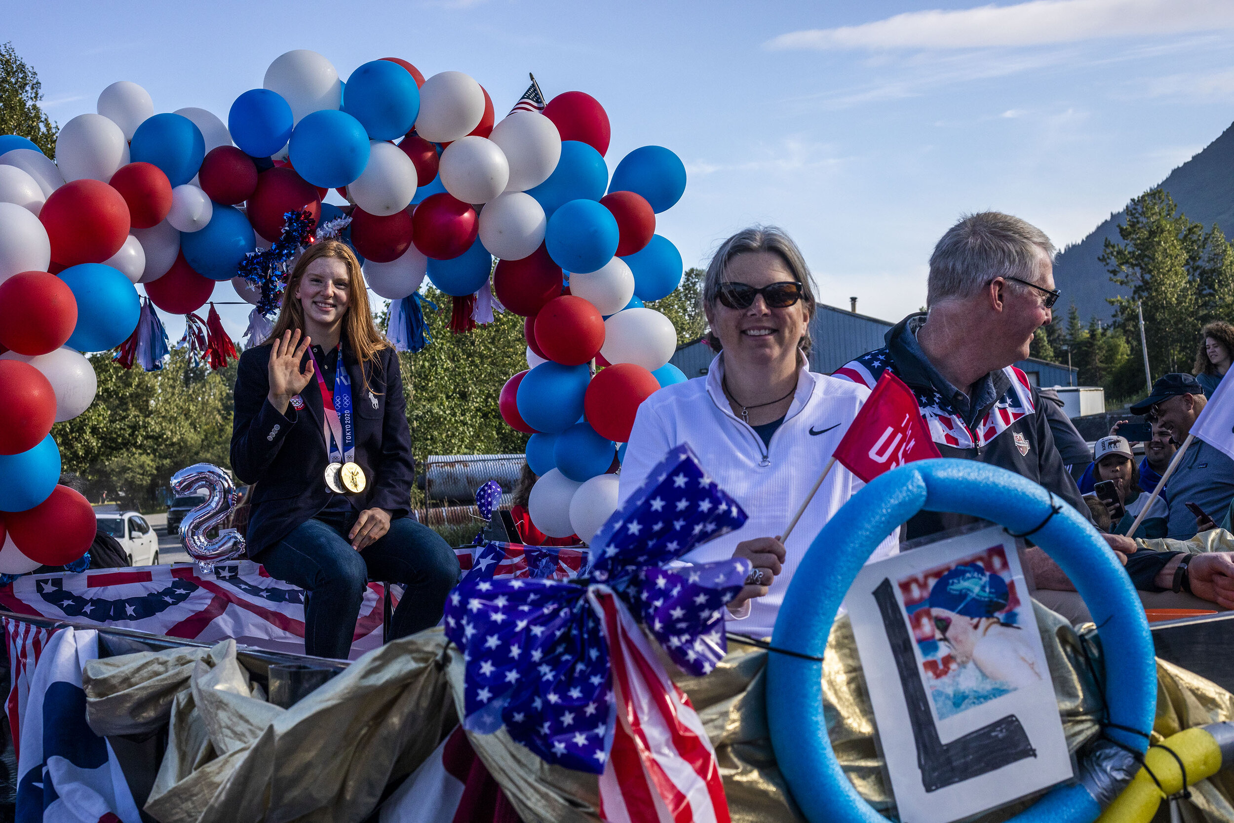 Lydia Jacoby and her parents soak in the love from their local community on August 5, 2021 in Seward, Alaska.