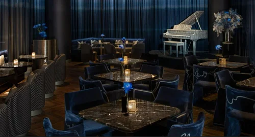 Velvet lounge seating in the Silver Linings room at Moxy Bowery, New York