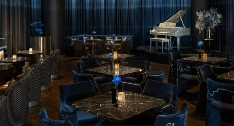 Velvet lounge seating in the Silver Linings room at Moxy Bowery, New York