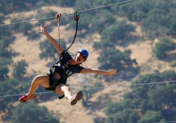 Feel the rush of air and excitement on zip lines at Vista Lago Adventure Park