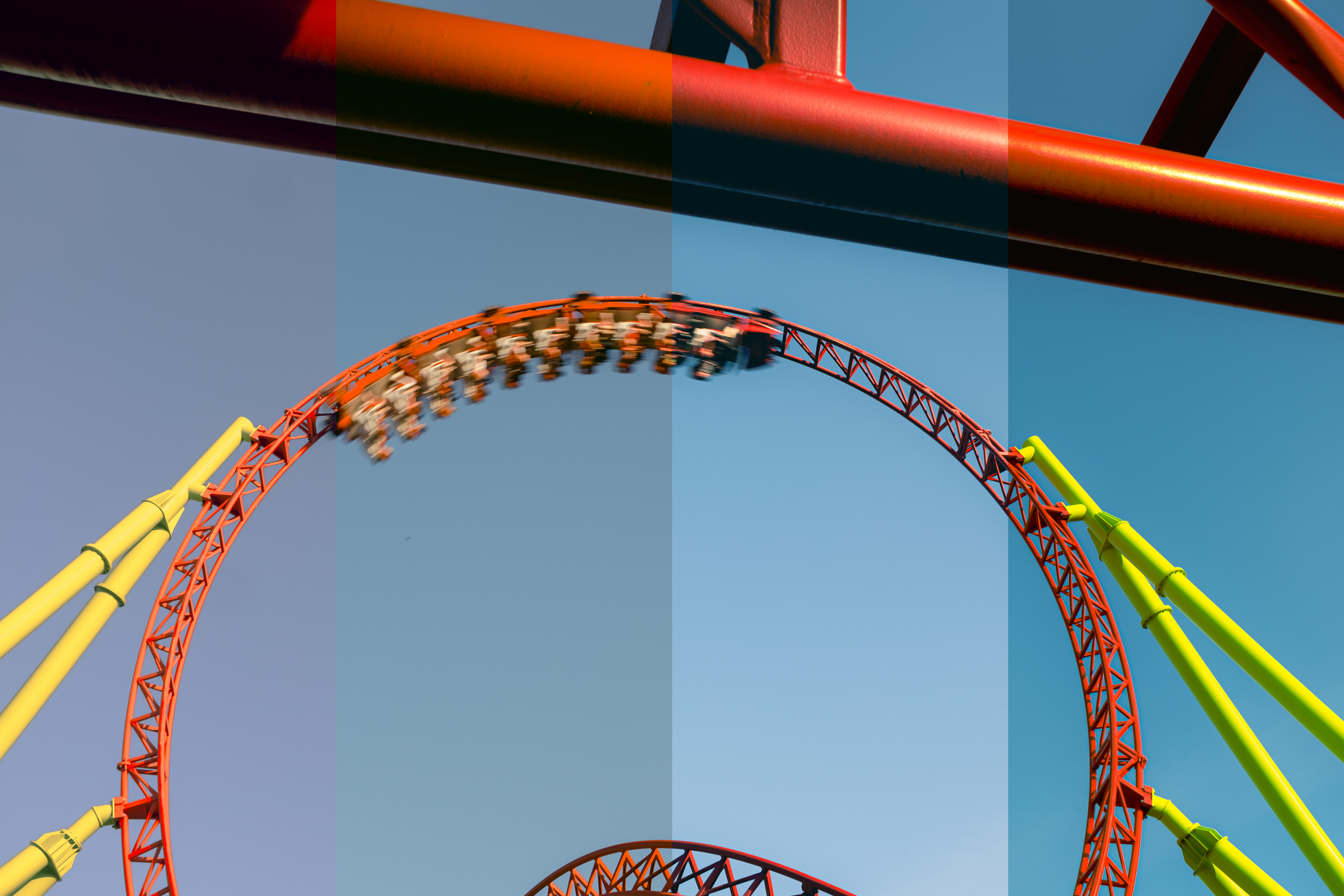 Color-filtered roller coaster loop with bright red and yellow tracks.