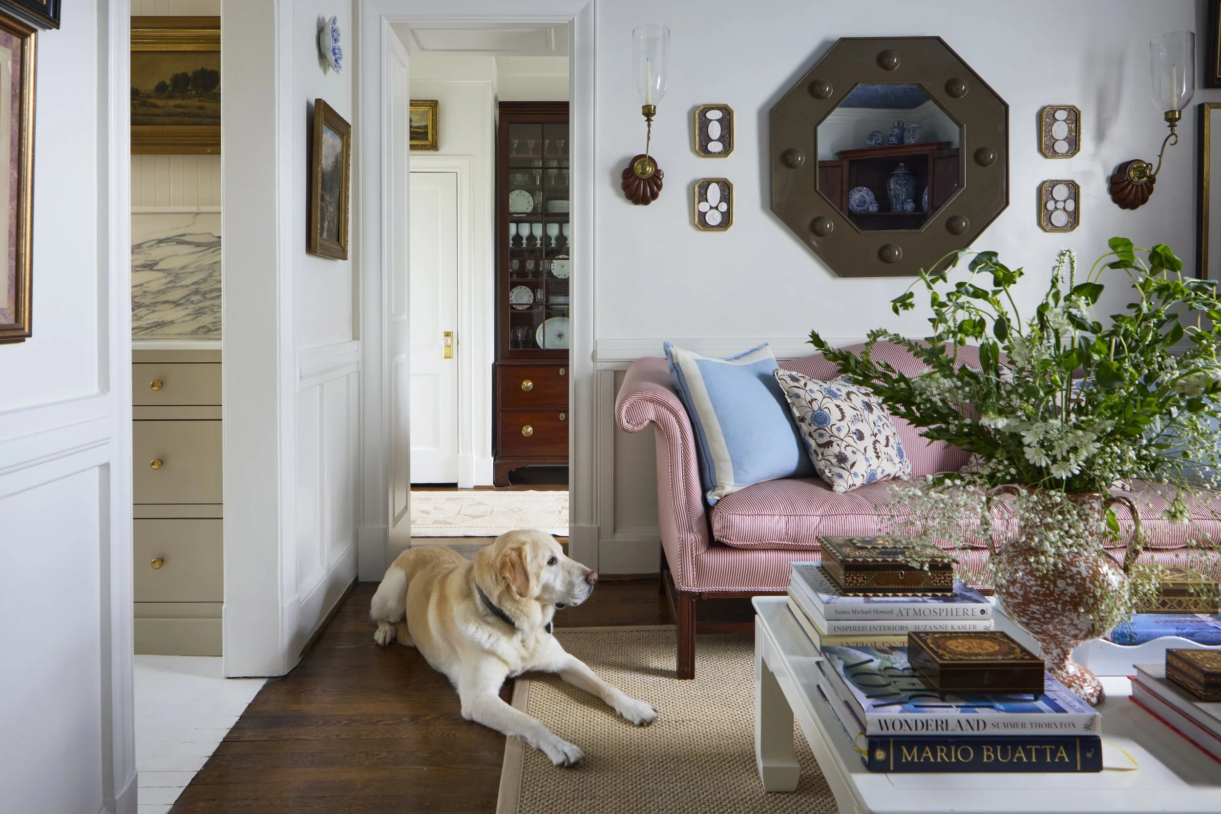 8_Ashley Hanley 1939 Forever Home Living Room with Grady looking into Party Pantry.jpg