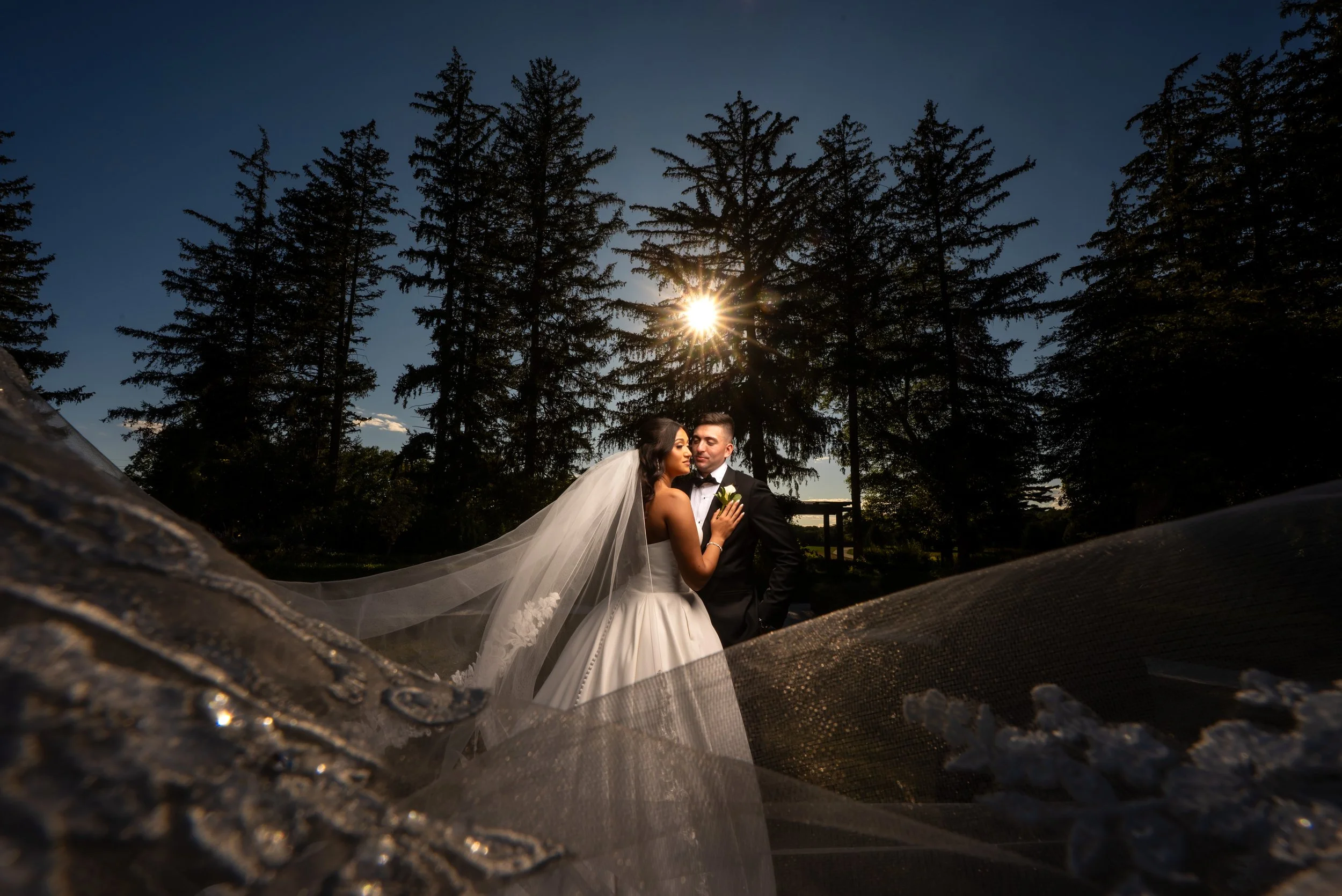 "New Jersey Wedding Photographer" a bride and groom pose in front of the sun