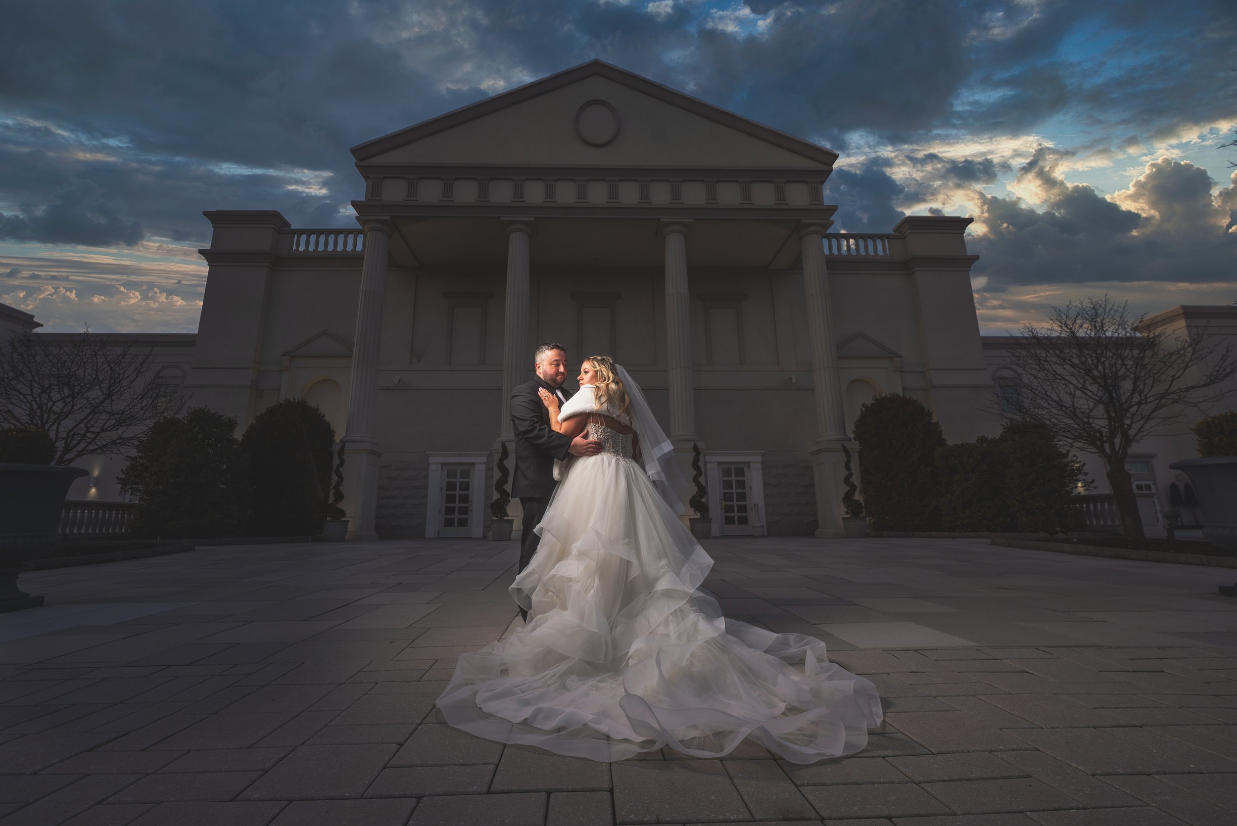 "New Jersey Wedding Photographer" a bride and groom pose in front of "The Palace at Somerset Park"