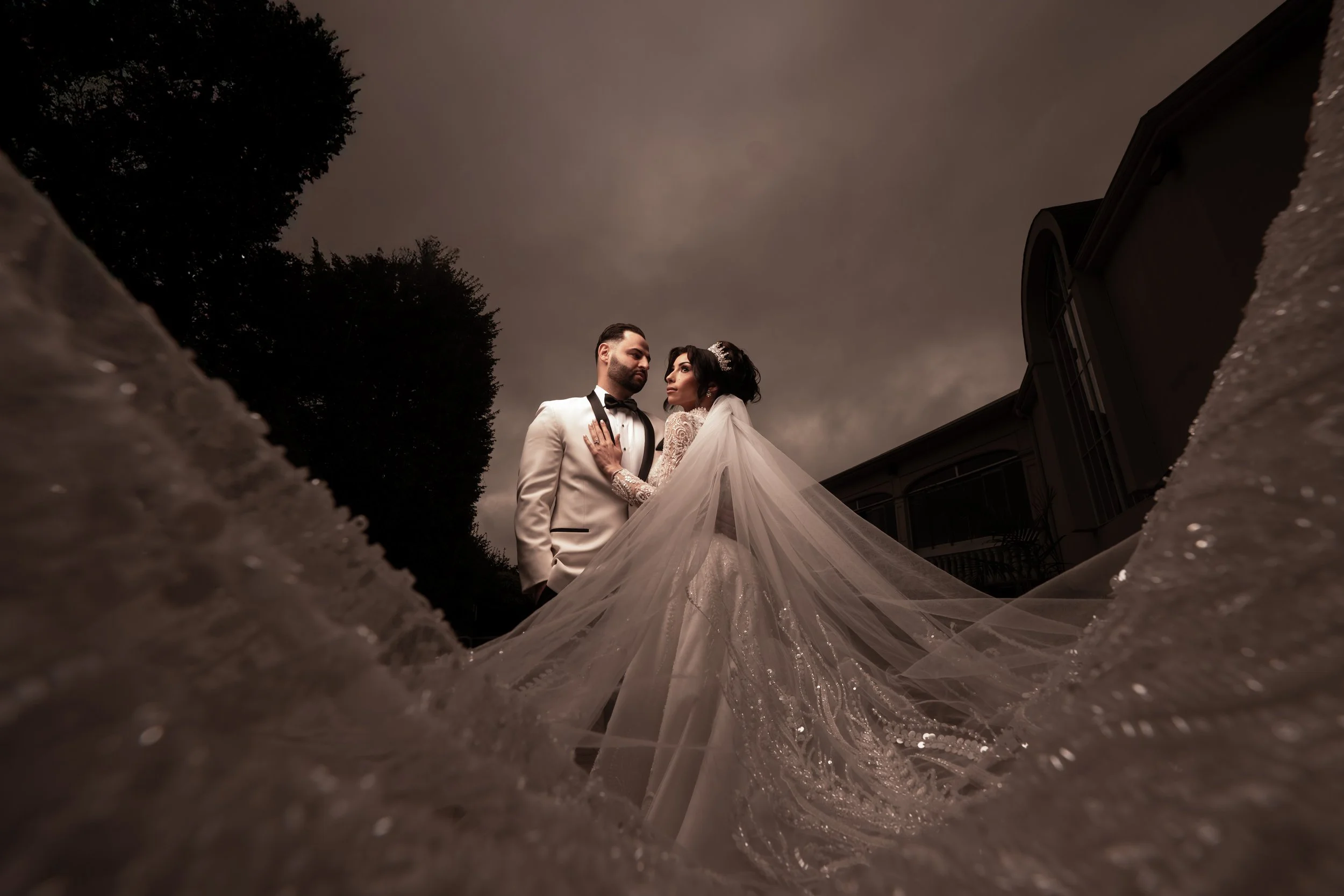 "New Jersey Wedding Photographer" a bride and groom pose in front of the westmount country club