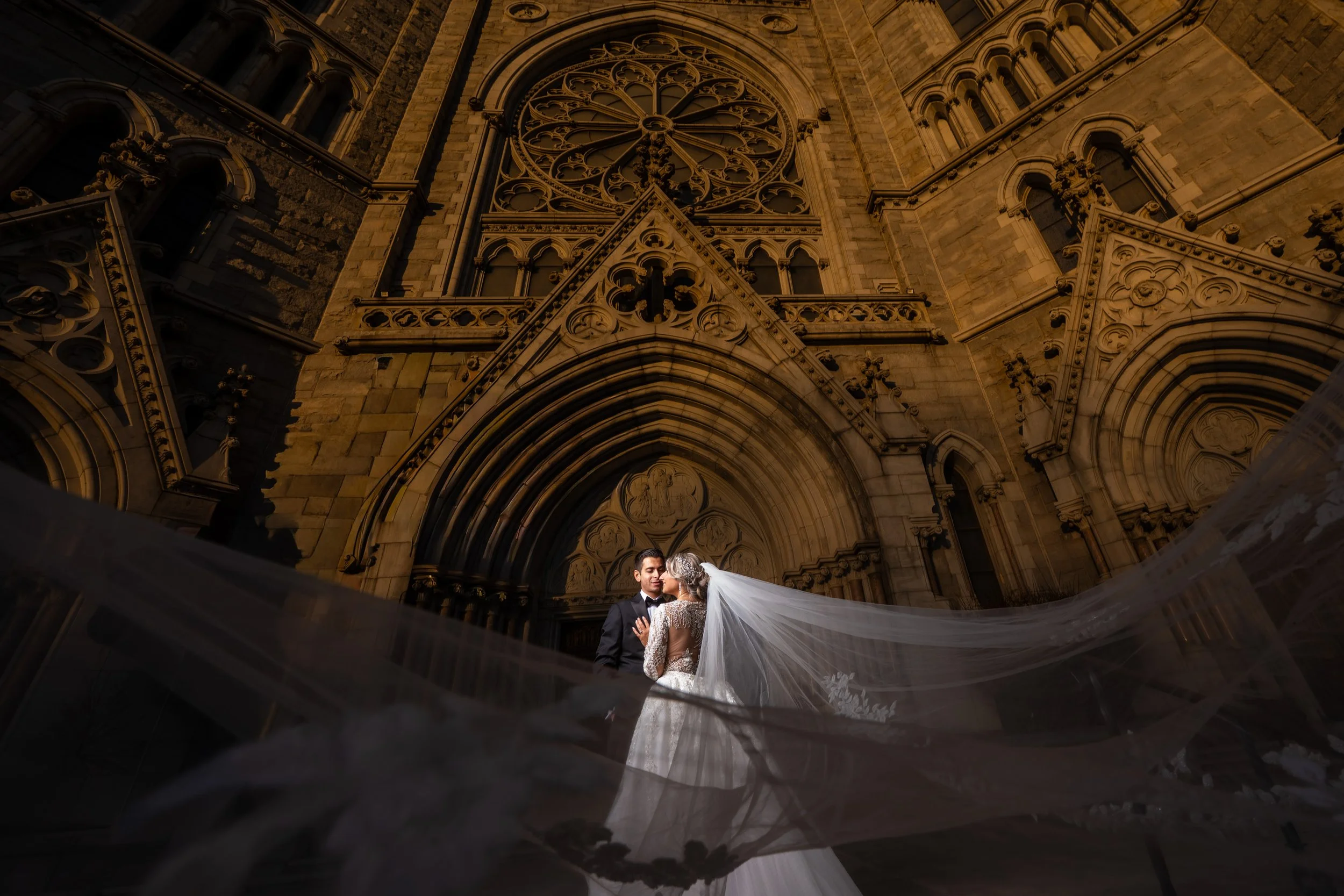 "New Jersey Wedding Photographer" a bride and groom pose in front of a church for a portrait
