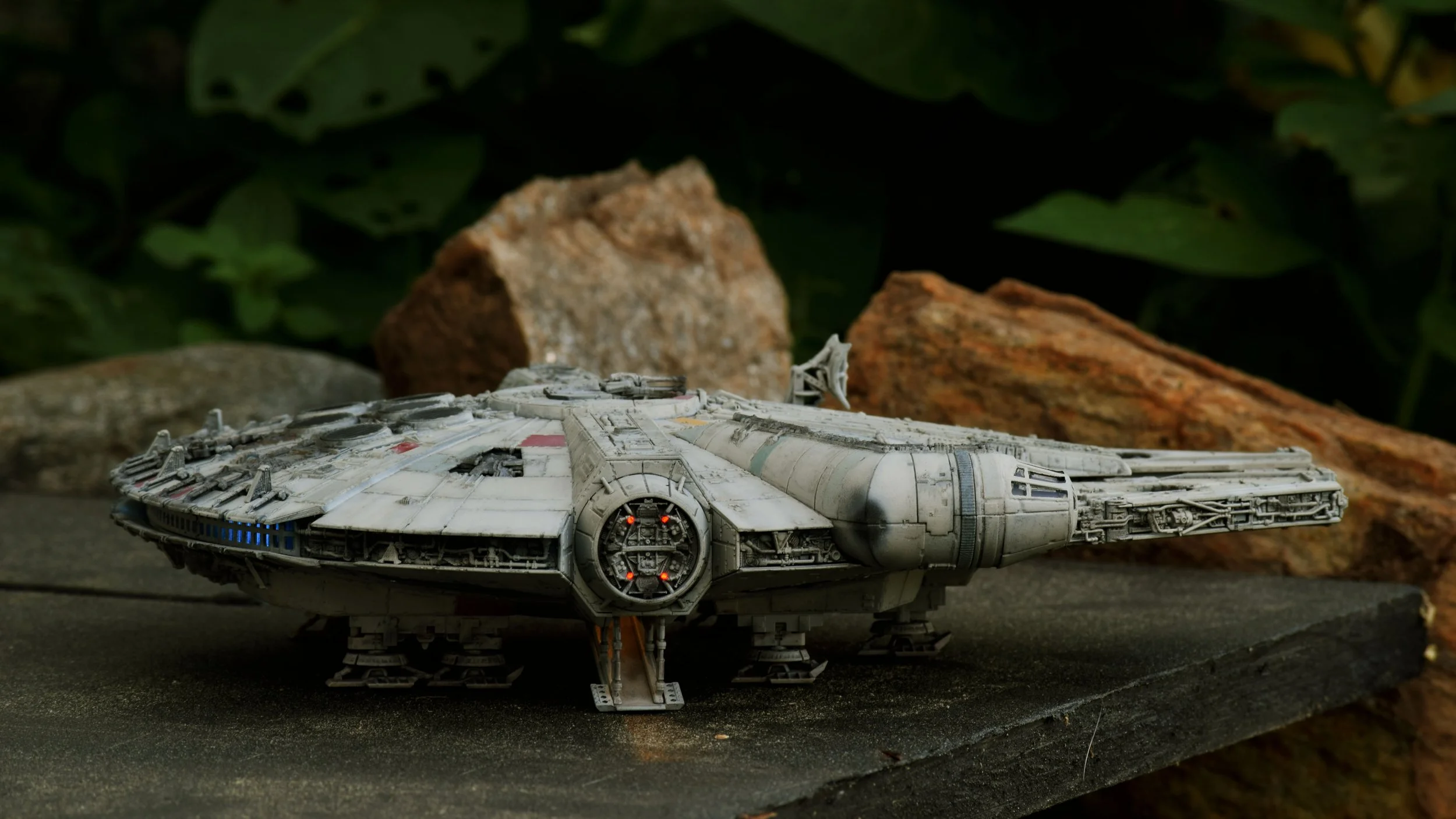 Bandai's 1/144 Millennium Falcon is a joy of a kit to build and detail. I installed fiber optic lighting and hid a battery box between the rear landing gear.