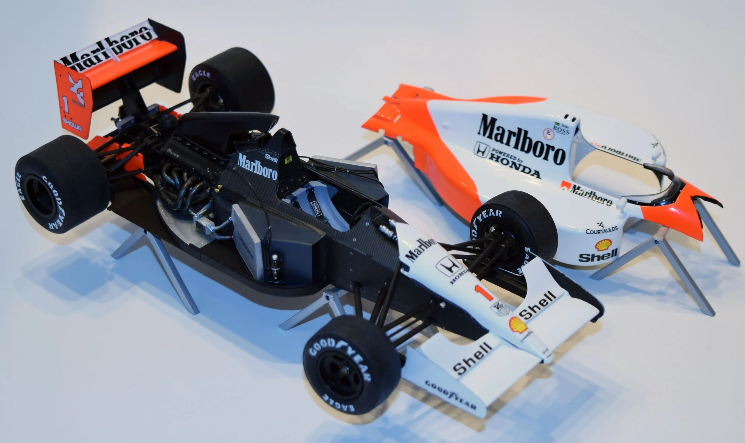 This 1/20 scale McLaren MP4/6 didn't fit together very well, so I improvised with garage stands and interior detail.