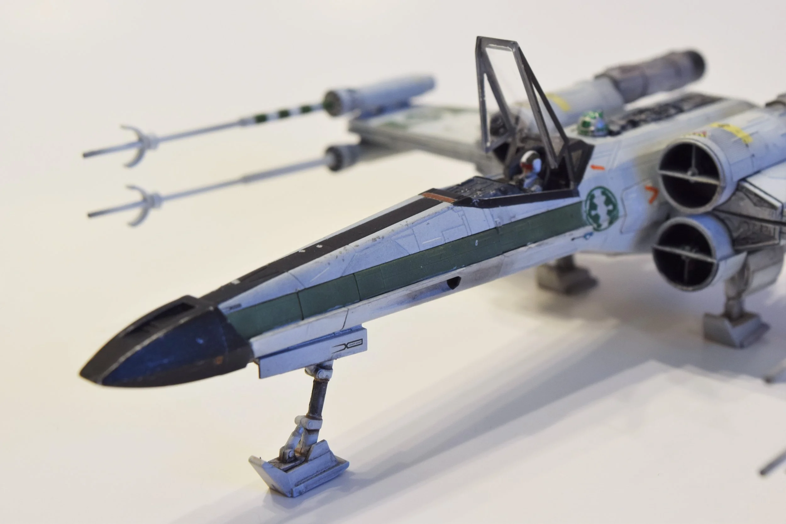 Bandai's 1/72 scale X-Wing, built on commission in Corellian Security Forces colors. This is a custom paint scheme based on a legends universe storyline.