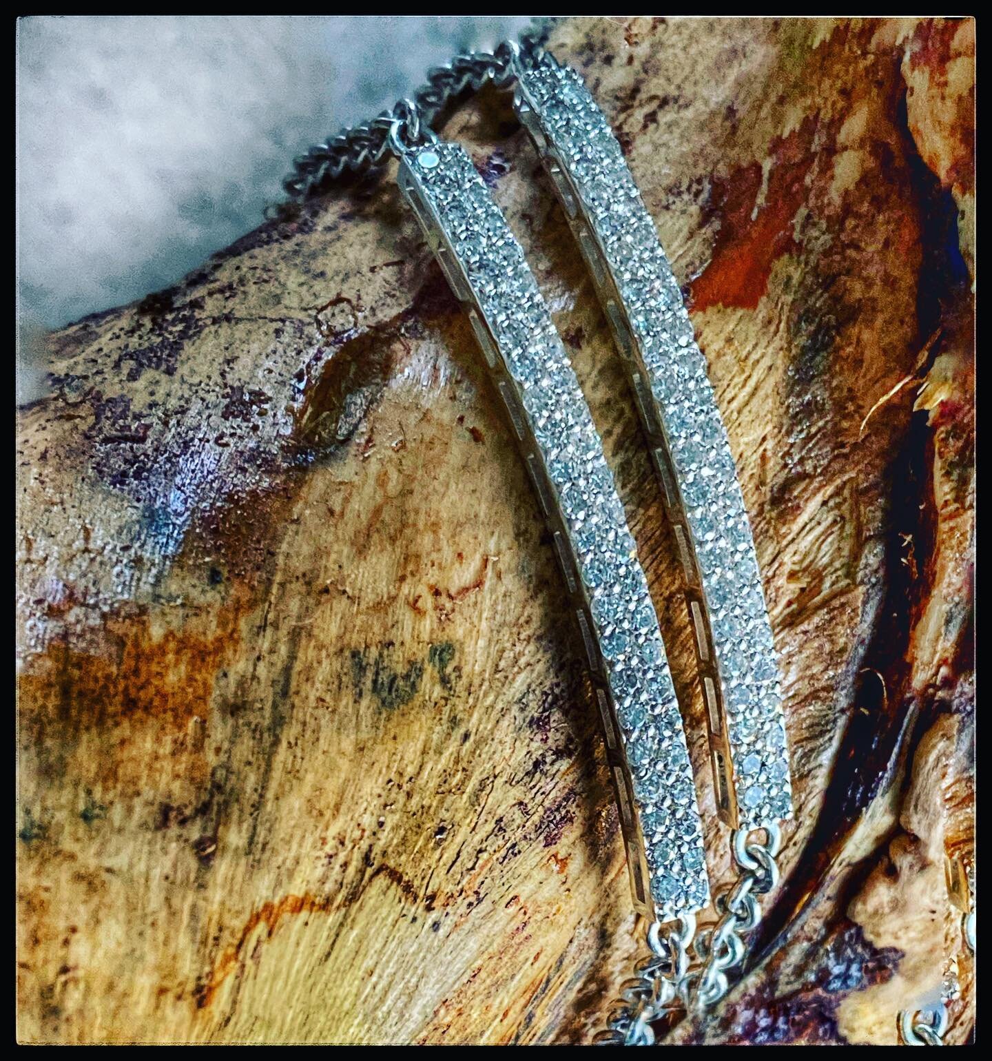 Sister bracelets, literally. Their mother had me dismantle an elaborate diamond necklace that was never worn and was in stored in a safety deposit box for decades.I created the double pave diamond bar and silver chain for them to wear everyday. Diamo