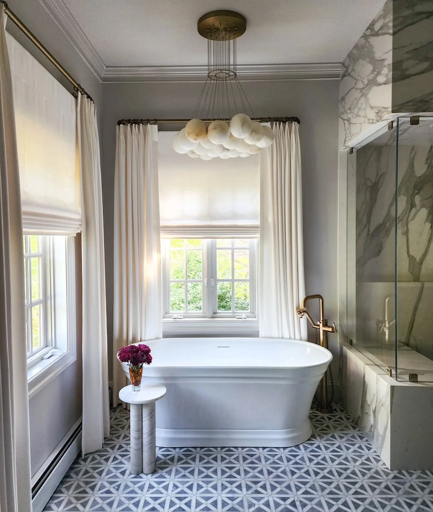 R E L A X  primary bathroom renovation with a spa like vibe.  Just add marble... Our client said that she took a bath in the new tub and she doesn't normally take baths, but WHY NOT with this tub? We used honed porcelain slabs in the steam shower bec