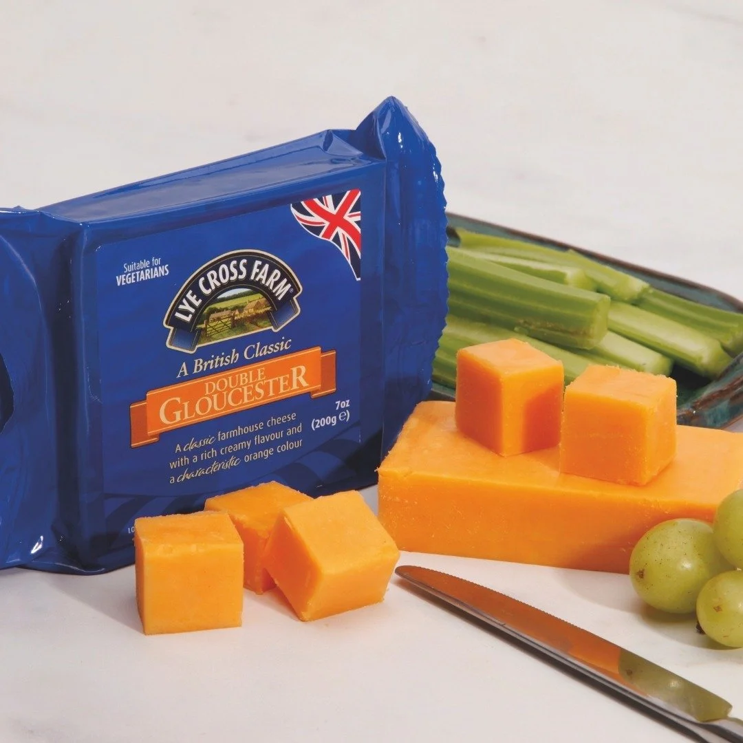 Lye Cross Farms Double Gloucester is a classic farmhouse cheese. It has a rich, creamy flavor and a characteristic orange color that is sure to stand out on your next charcuterie board. 

#abbey #abbeyspecialtyfoods #lyecrossfarm #doublegloucester #e