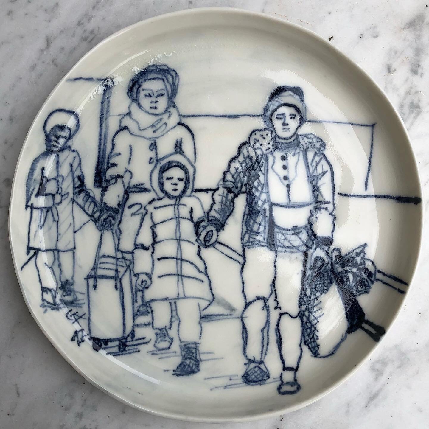 Installation for Wells Art Contemporary. Refugee porcelain plates will hopefully go on display in the Wells Cathedral library under glass in waist high display cabinets. The images of mothers clutching their children and a few essential belongings ma