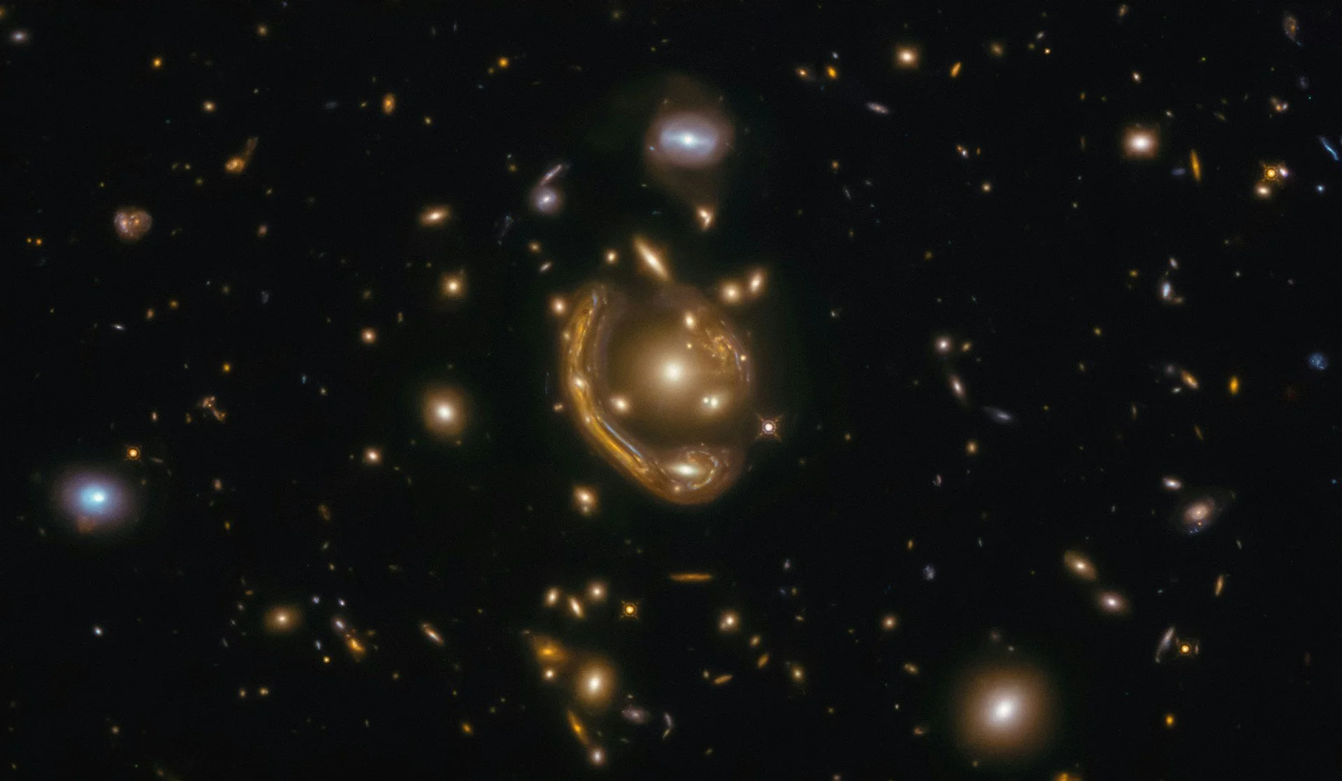 Deep space image of galaxies warped by gravitational lensing