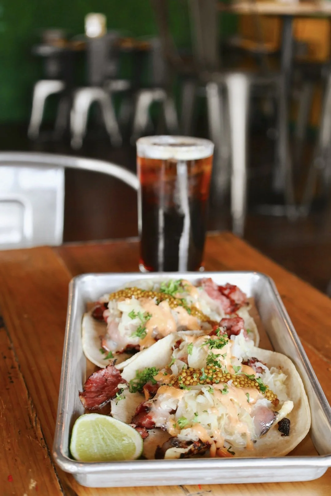 hot pastrami tacos, griddled pastrami, sauerkraut, Russian dressing, melted Swiss cheese, onion, mustard seed salsa.