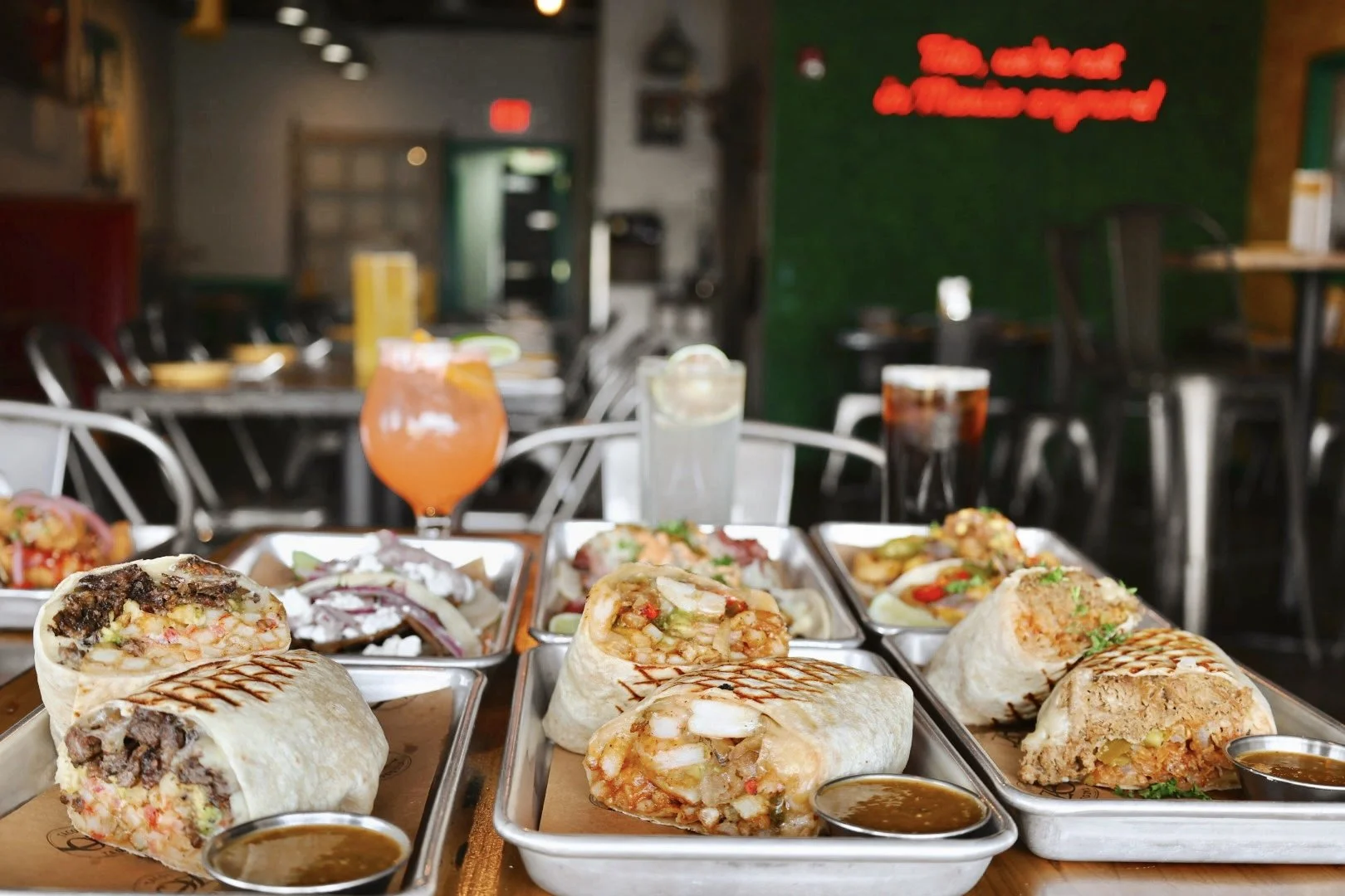 Assorted Mexican burritos including mermaid burrito el Gordita burrito, and the California burrito