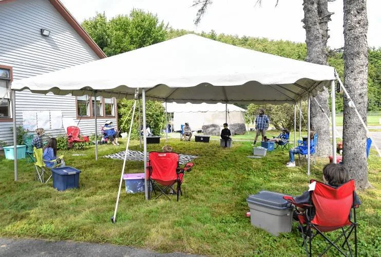  Students started in-person learning outside at the Greenfield Center School under tents and around the grounds on Wednesday. Staff Photo/PAUL FRANZ 