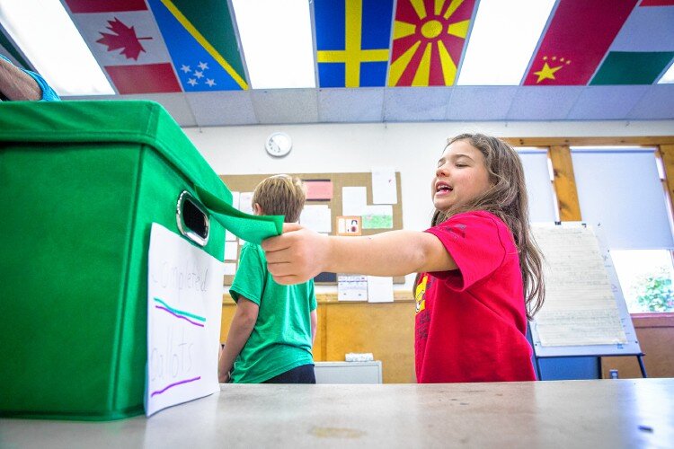  Ada Quilter, a student at the Center School in Greenfield, casts her ballot after voting in the school’s mock election Tuesday. The candidates were “Shellizabeth Warren” and “Jill Swine.” Recorder Staff/Matt Burkhartt 